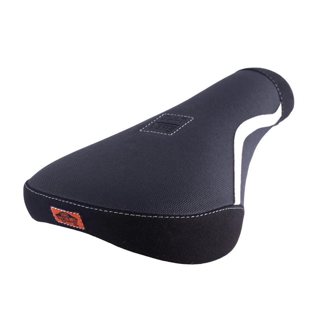 Selle BMX noire Vans avec coutures blanches et logo orange, design ergonomique pour freestyle