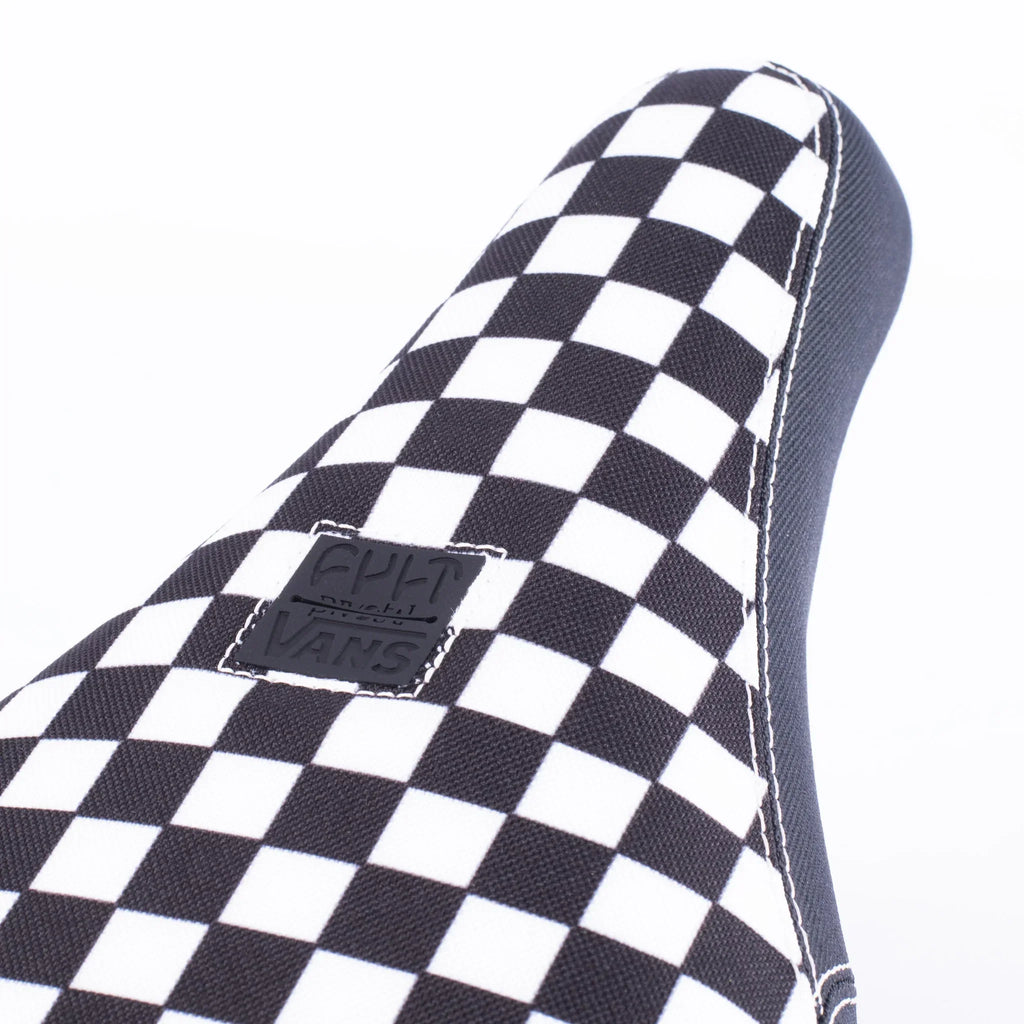 Selle BMX à motif damier noir et blanc avec logo Vans, design classique pour vélo de rue