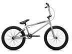 Vélo BMX argent avec cadre violet, roues noires et selle ergonomique pour freestyle et tricks