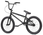 Vélo BMX noir complet avec cadre WE THE PEOPLE, idéal pour tricks et freestyle