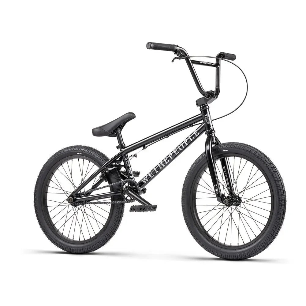 Vélo BMX noir complet avec cadre et roues noires, idéal pour tricks et freestyle